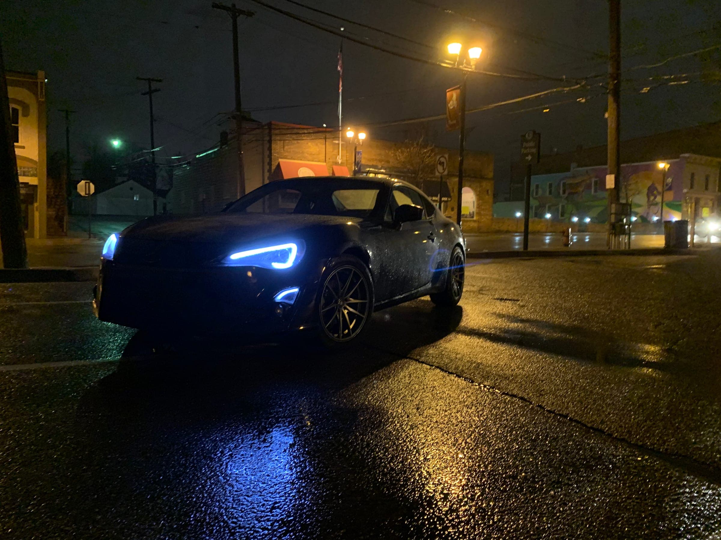 BRZ in road in town at night